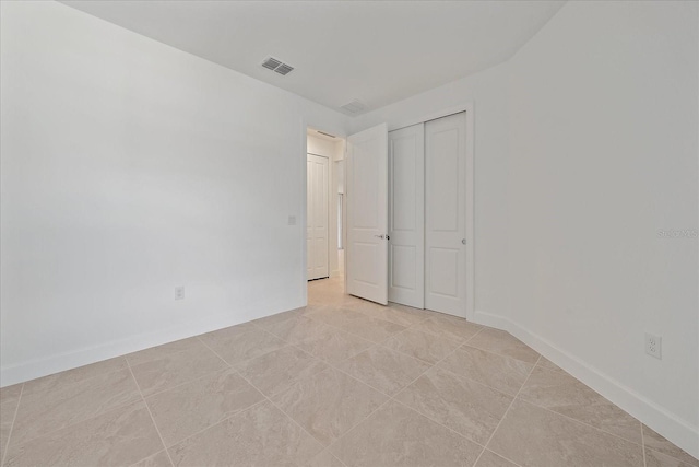 unfurnished bedroom with light tile patterned floors