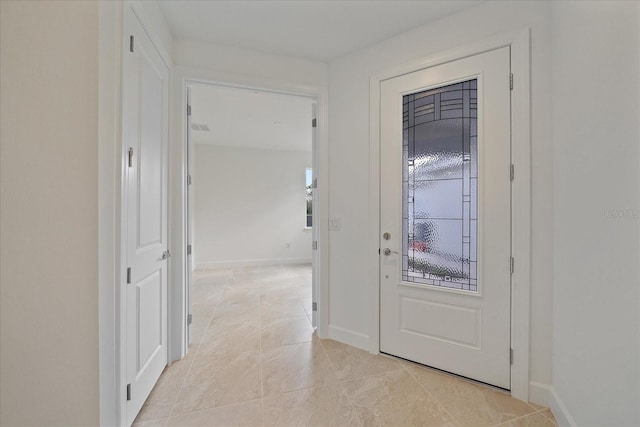 entrance foyer featuring light tile patterned floors