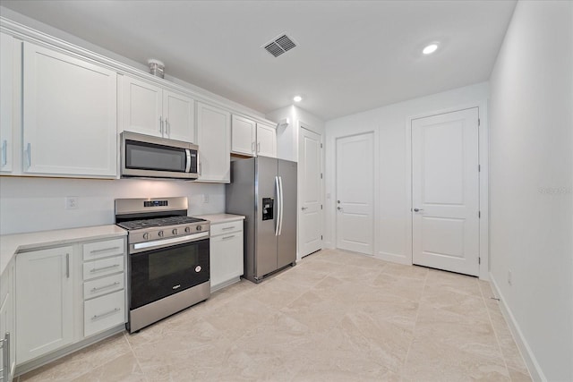 kitchen featuring white cabinetry and stainless steel appliances