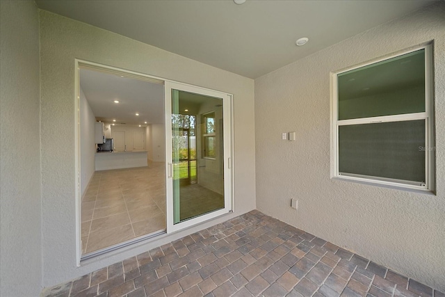 entrance to property featuring a patio area