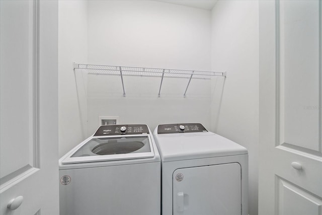 washroom with washing machine and dryer