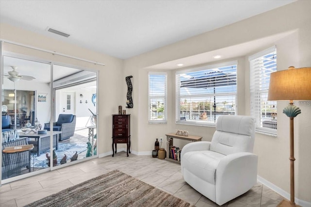 living area featuring ceiling fan