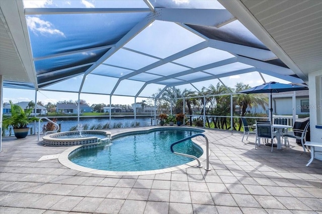 view of swimming pool with a lanai, an in ground hot tub, a water view, and a patio