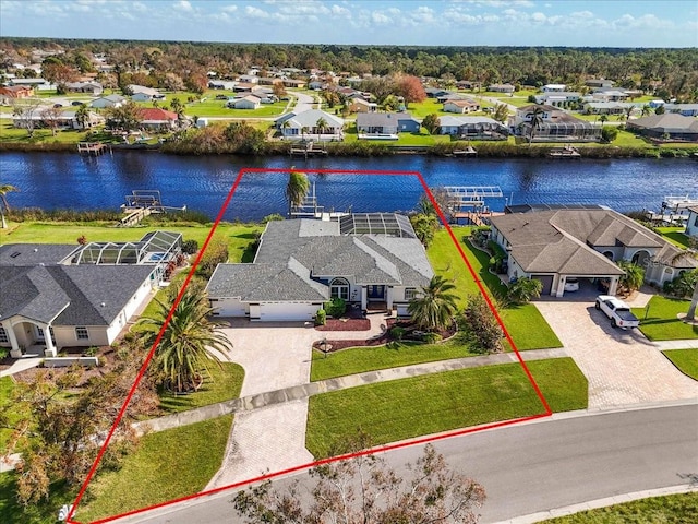 birds eye view of property with a water view