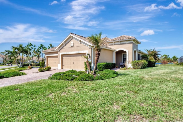 view of front facade featuring a garage and a front lawn