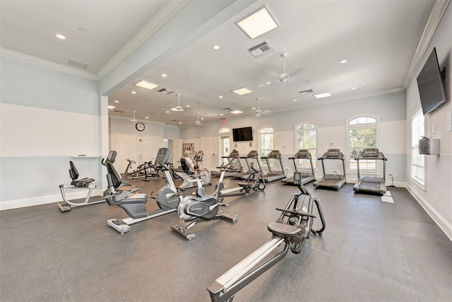 gym featuring ceiling fan and ornamental molding