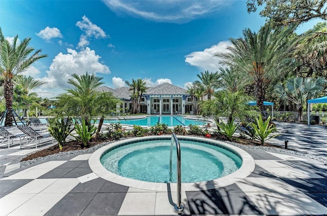 view of pool featuring a hot tub