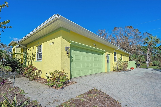 view of property exterior featuring a garage