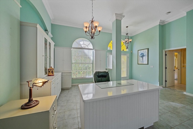 kitchen featuring a kitchen island, white cabinets, hanging light fixtures, and black electric cooktop