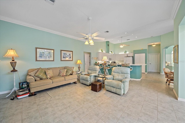 living room with ornamental molding, light tile patterned floors, and ceiling fan