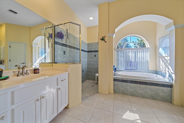 bathroom with vanity, independent shower and bath, and tile patterned flooring