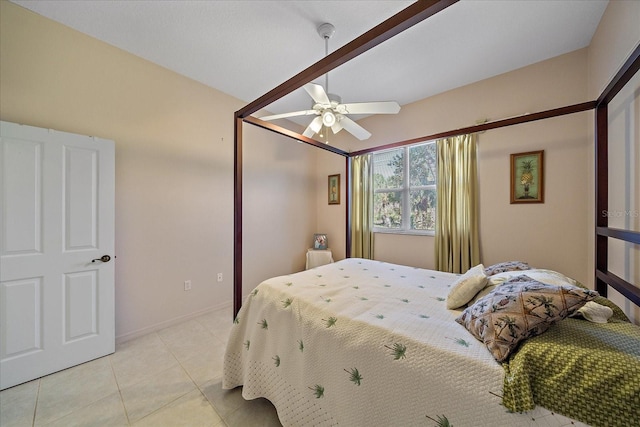 tiled bedroom with vaulted ceiling and ceiling fan