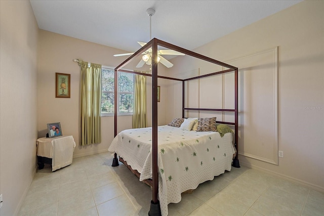 bedroom with light tile patterned floors and ceiling fan