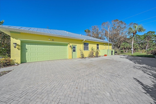 single story home with a garage