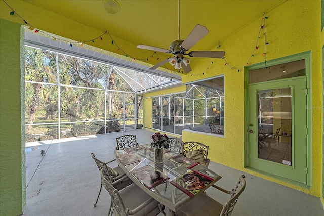 sunroom featuring ceiling fan and lofted ceiling