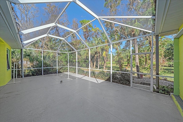 view of patio featuring a lanai