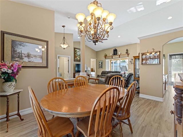 dining room with lofted ceiling, light hardwood / wood-style flooring, and plenty of natural light