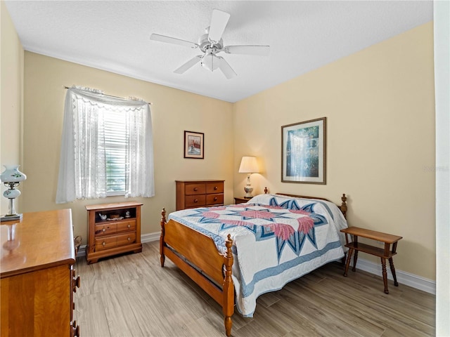 bedroom featuring light hardwood / wood-style flooring and ceiling fan