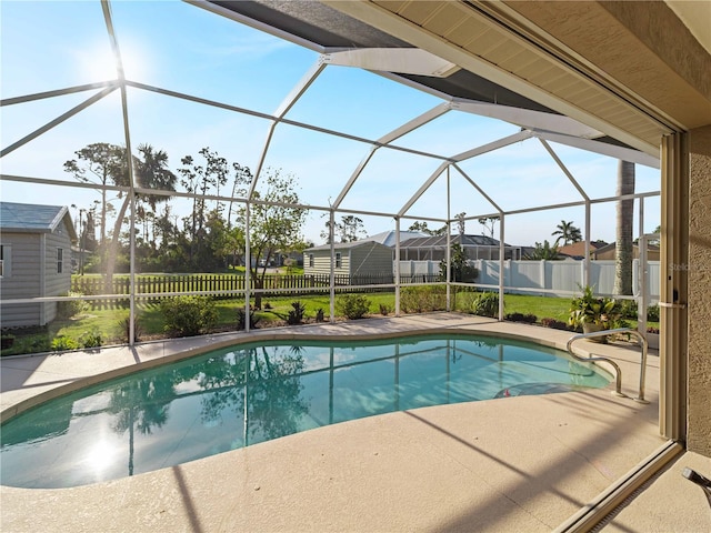 view of pool featuring a patio area and a lanai