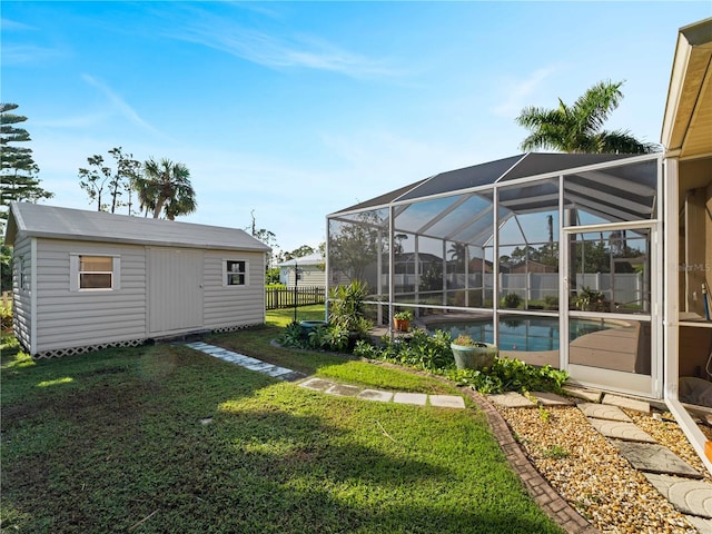 view of yard with glass enclosure, a storage unit, and a fenced in pool