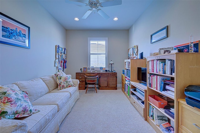 carpeted office space with ceiling fan