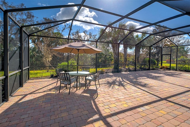 view of patio / terrace featuring glass enclosure