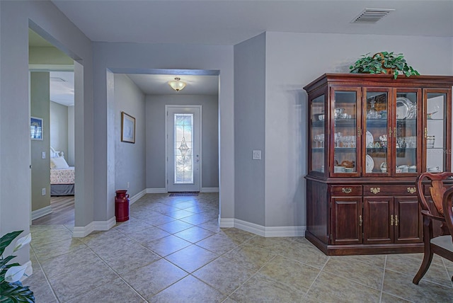 entrance foyer featuring light tile patterned flooring