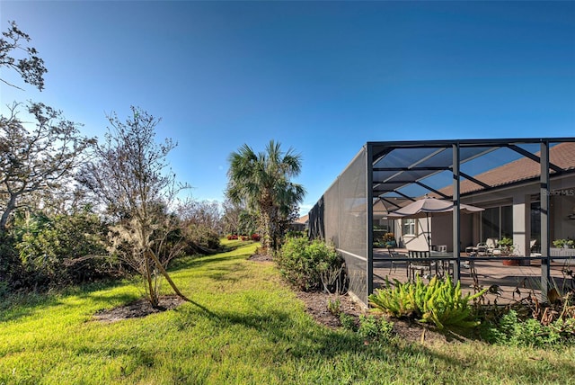 view of yard with a patio area and a lanai