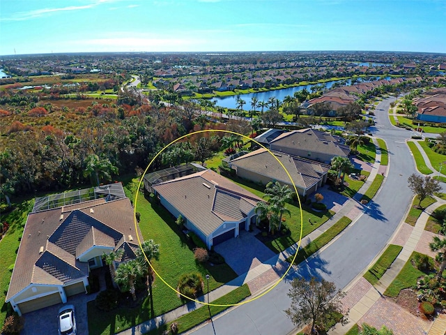 birds eye view of property with a water view