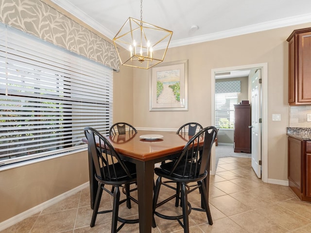 dining room with an inviting chandelier, crown molding, and light tile patterned flooring