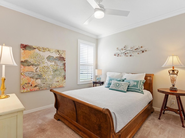 carpeted bedroom featuring crown molding and ceiling fan