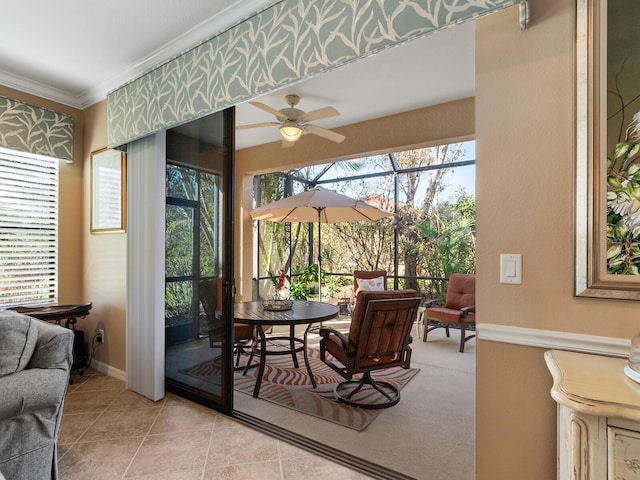 interior space with ceiling fan