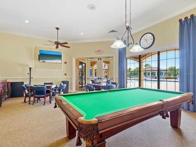 rec room with crown molding, ceiling fan, pool table, light colored carpet, and french doors