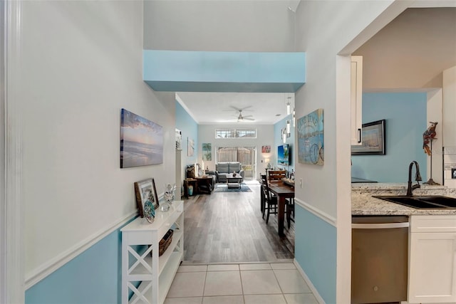 hall with sink and light hardwood / wood-style floors