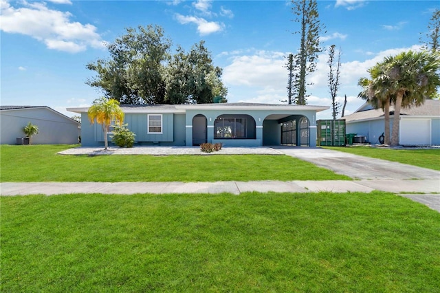 ranch-style home featuring a carport and a front yard