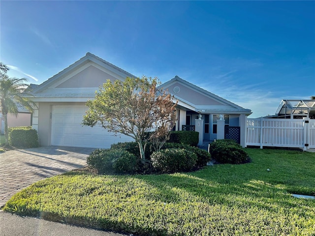 view of front facade featuring a garage and a front lawn