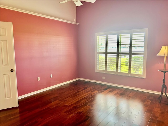 spare room with ceiling fan and dark hardwood / wood-style floors