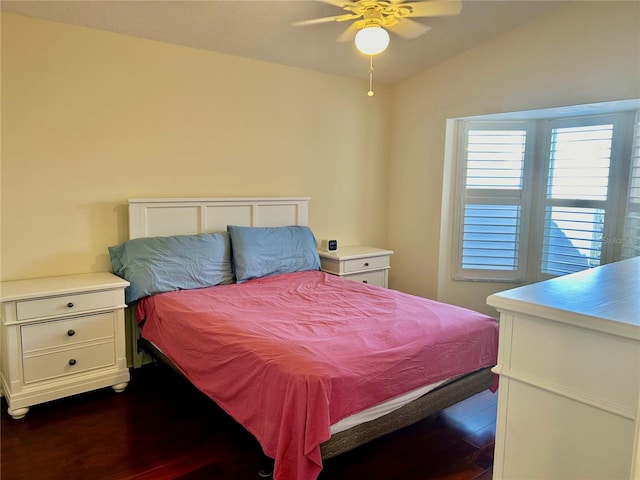 bedroom featuring ceiling fan, lofted ceiling, and dark hardwood / wood-style floors