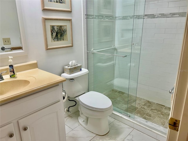 bathroom with vanity, walk in shower, and toilet