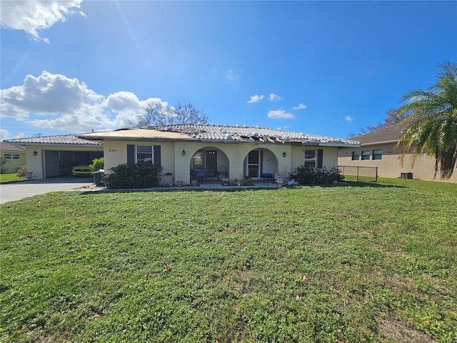 view of front facade with a front lawn and a garage