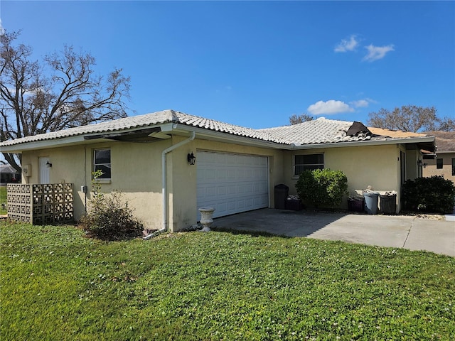 view of property exterior with a yard and a garage