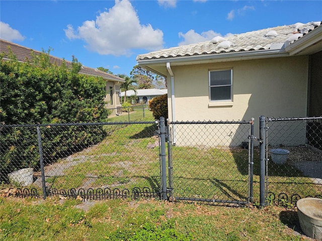 view of side of property with a lawn