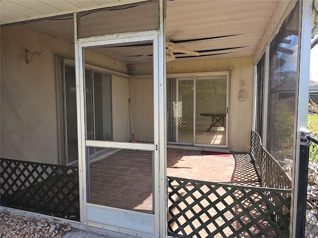 exterior space with ceiling fan