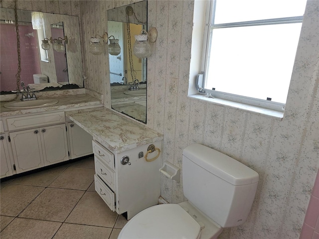 bathroom with vanity, toilet, and tile patterned floors