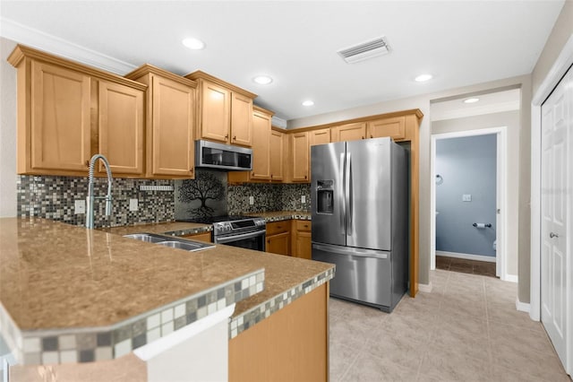 kitchen with appliances with stainless steel finishes, light tile patterned floors, kitchen peninsula, and decorative backsplash