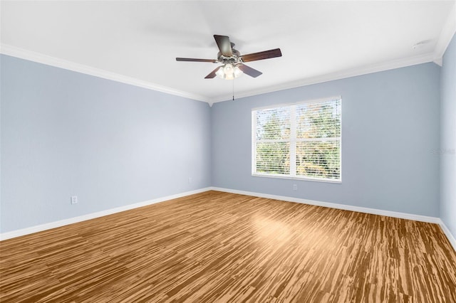 spare room with ceiling fan, ornamental molding, and hardwood / wood-style floors