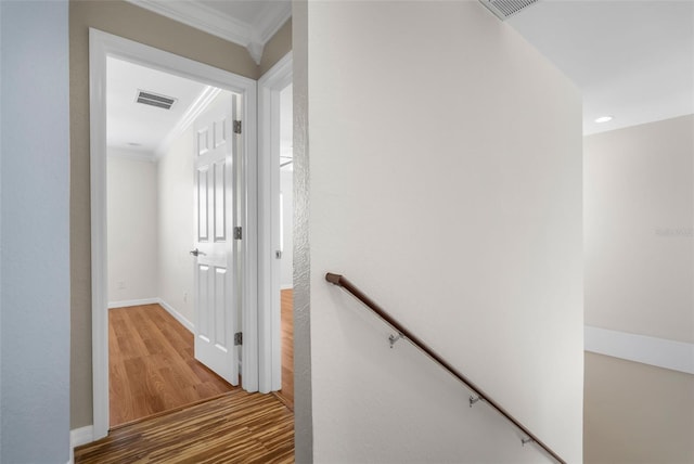 hallway featuring crown molding and wood-type flooring