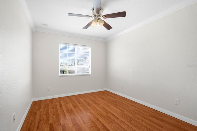 unfurnished room with ornamental molding, hardwood / wood-style flooring, and ceiling fan