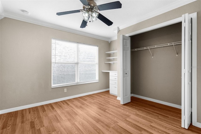 unfurnished bedroom with a closet, ceiling fan, ornamental molding, and light hardwood / wood-style flooring