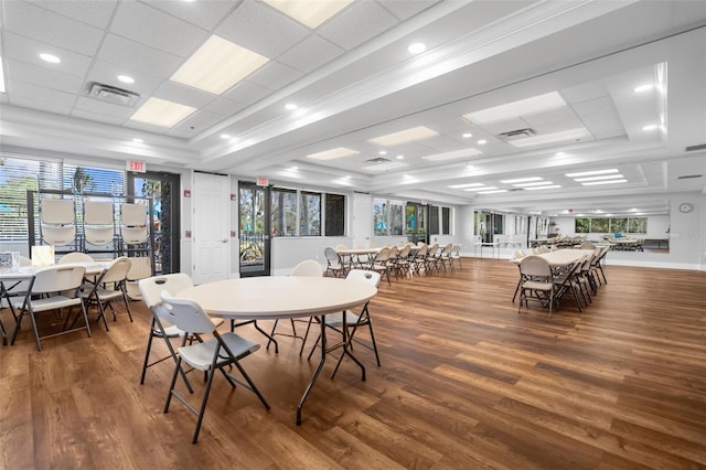 dining area featuring dark wood-type flooring and a wealth of natural light